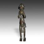 Standing Female Figure Drinking from Vessel